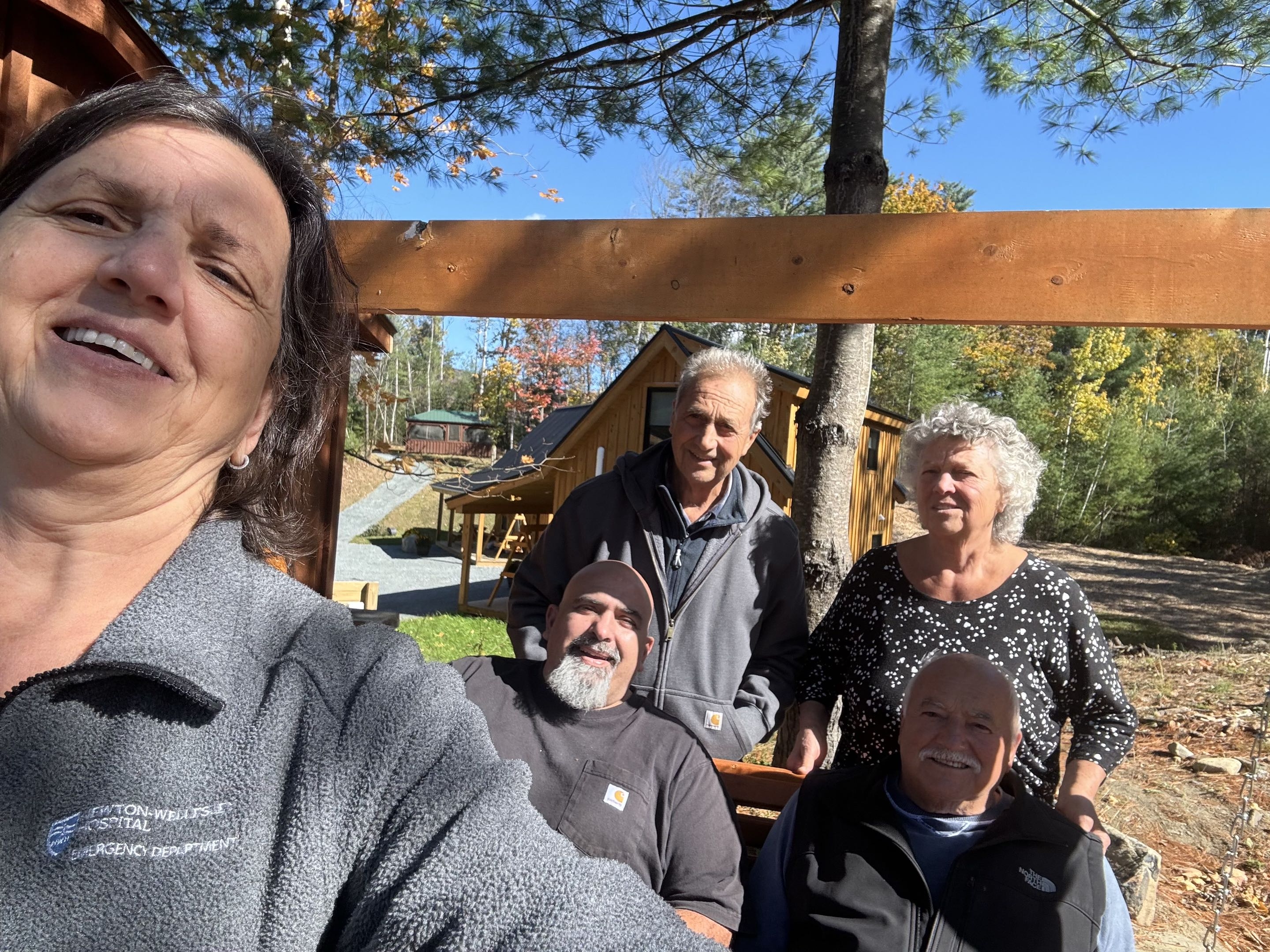 Family selfie with the cabins in the background